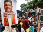 People in Kolkata gather in solidarity with Cockroach Janta Party (CJP) protests held at Jantar Mantar in New Delhi and elsewhere, demanding the resignation of education minister Dharmendra Pradhan over exam paper leaks, on July 24, 2026. The placard here asks if the "resignation paper, too, leaked".