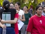 NEET-UG candidates exit an examination centre in New Delhi after appearing for the retest on June 21. (PTI)