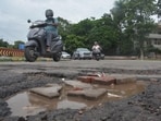 The road outside the main gate of Mansa Devi Temple is also in a poor condition. (Sant Arora/HT)