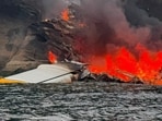 The Kenmore Air floatplane on fire after the crash in the San Juan Islands area. 