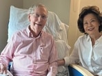 Mitch McConnell with his wife. The photo was shared as a 'proof of life' amid rising conspiracy theories.