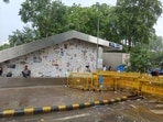 Glass panels at entry of Janpath metro station covered with newspapers