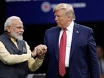 File image: Prime Minister Narendra Modi and Donald Trump shake hands after introductions during the 'Howdi Modi' event.