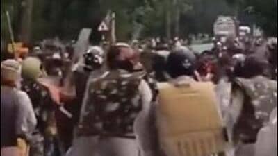 A video clip on the X website showed villagers confronting the police team on a main road (Videograb)