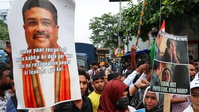 People gather in Kolkata in solidarity with Cockroach Janta Party (CJP) protests held at Jantar Mantar in New Delhi and elsewhere, demanding the resignation of Education Minister Dharmendra Pradhan over exam paper leaks, on July 24, 2026. The banner here asks whether... 
