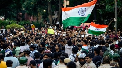 CJP supporters wave the national flag during a protest demanding the resignation of Pradhan over NEET paper leak issue. (PTI) CJP supporters wave the national flag during a protest demanding the resignation of Pradhan over NEET paper leak issue. (PTI)