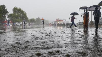 People walk amid rainfall in Shimla, Himachal Pradesh. (PTI) People walk amid rainfall in Shimla, Himachal Pradesh. (PTI)