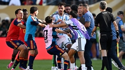 Argentina's Leandro Paredes and Lisandro Martinez clash with Spain's Gavi after the match. (REUTERS)