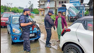 Security personnel check vehicles amid intensified search operations to track down the assailant behind the Anantnag shooting, in Shopian district on Friday. (PTI) Security personnel check vehicles amid intensified search operations to track down the assailant behind the Anantnag shooting, in Shopian district on Friday. (PTI)