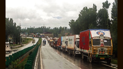 Trucks wait for traffic to resume on the Srinagar–Jammu National Highway due to inclement weather in Anantnag on Friday. (ANI) Trucks wait for traffic to resume on the Srinagar–Jammu National Highway due to inclement weather in Anantnag on Friday. (ANI)