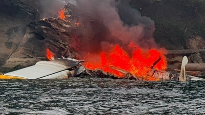 The Kenmore Air floatplane on fire after the crash in the San Juan Islands area. (Facebook/Puget Sound Boating and Dave Eastman) The Kenmore Air floatplane on fire after the crash in the San Juan Islands area. (Facebook/Puget Sound Boating and Dave Eastman)