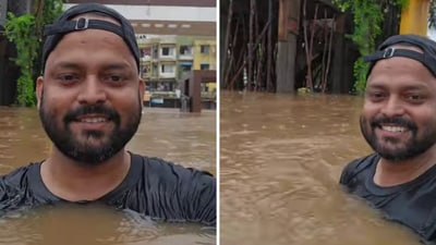 Shivam Singh stood in neck-deep water outside his housing society on July 23. (Instagram/@bankeronbike) Shivam Singh stood in neck-deep water outside his housing society on July 23. (Instagram/@bankeronbike)