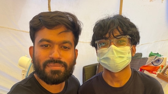 Nisarga Adhikary (in mask) with CJP's Abhijeet Dipke at the Jantar Mantar protest site in Delhi.