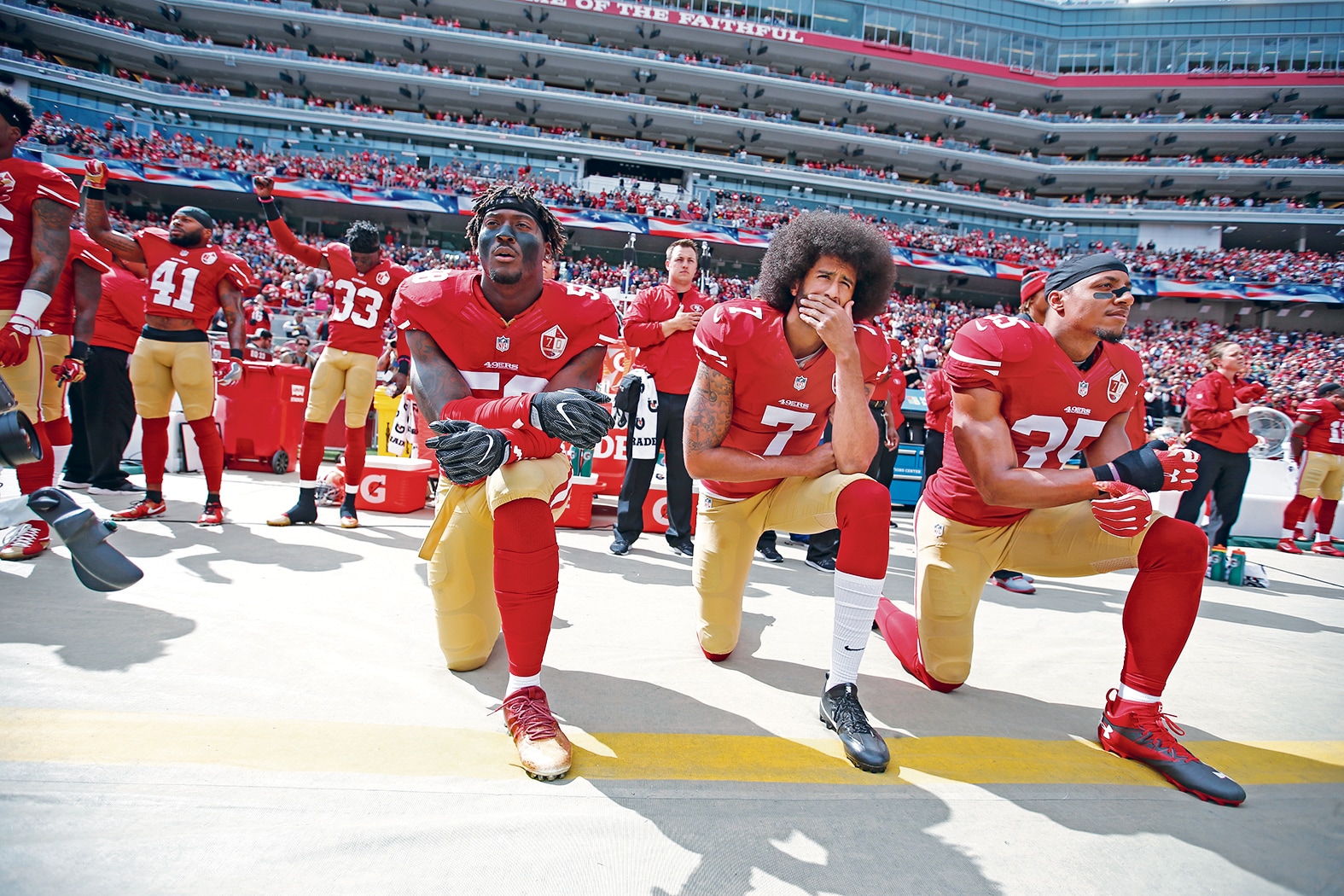 Footballer Colin Kaepernick takes a knee; 2016. Getty Images Footballer Colin Kaepernick takes a knee; 2016. Getty Images