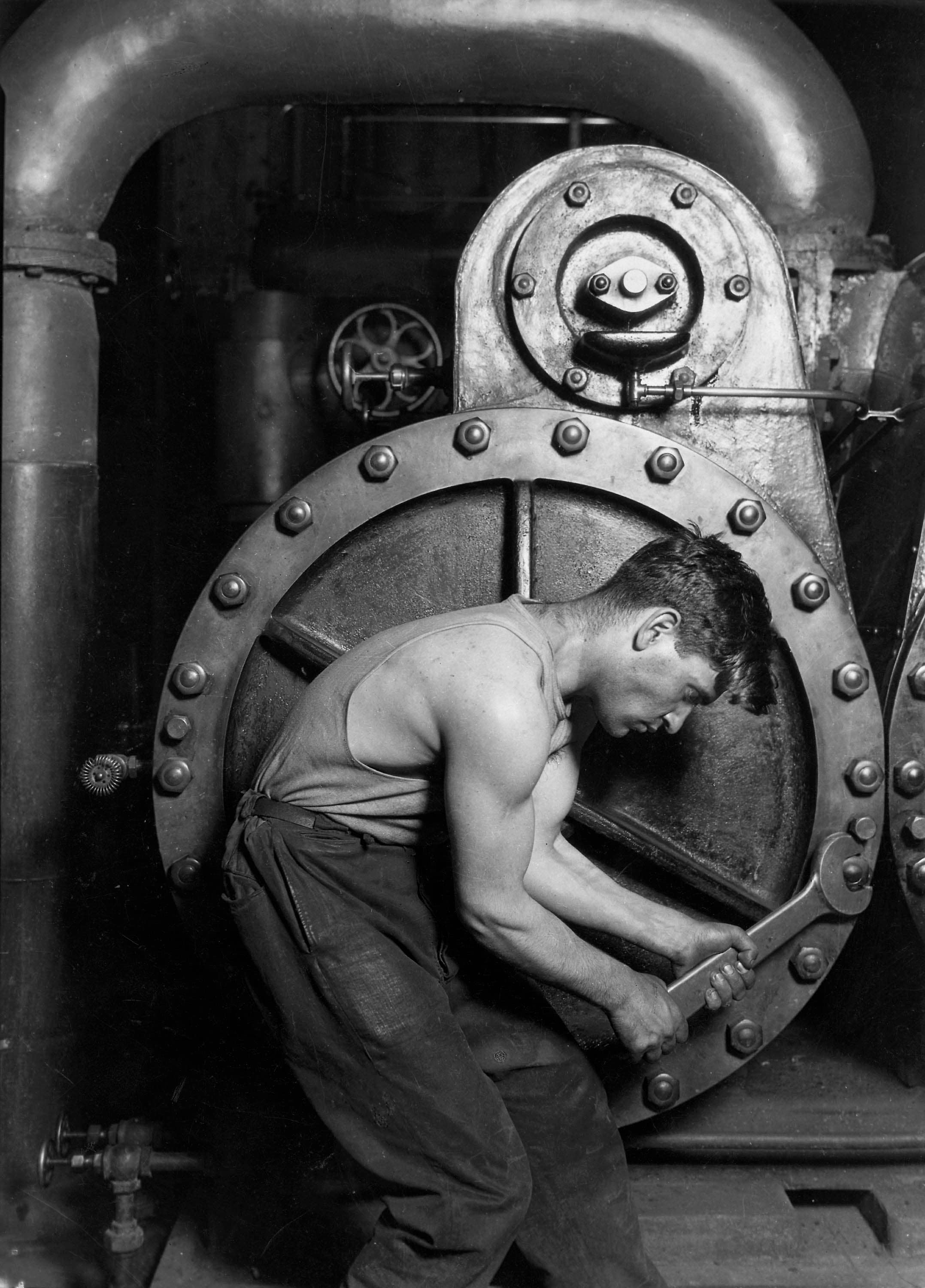 Power House Mechanic by Lewis Hine; 1920. Wikimedia Power House Mechanic by Lewis Hine; 1920. Wikimedia