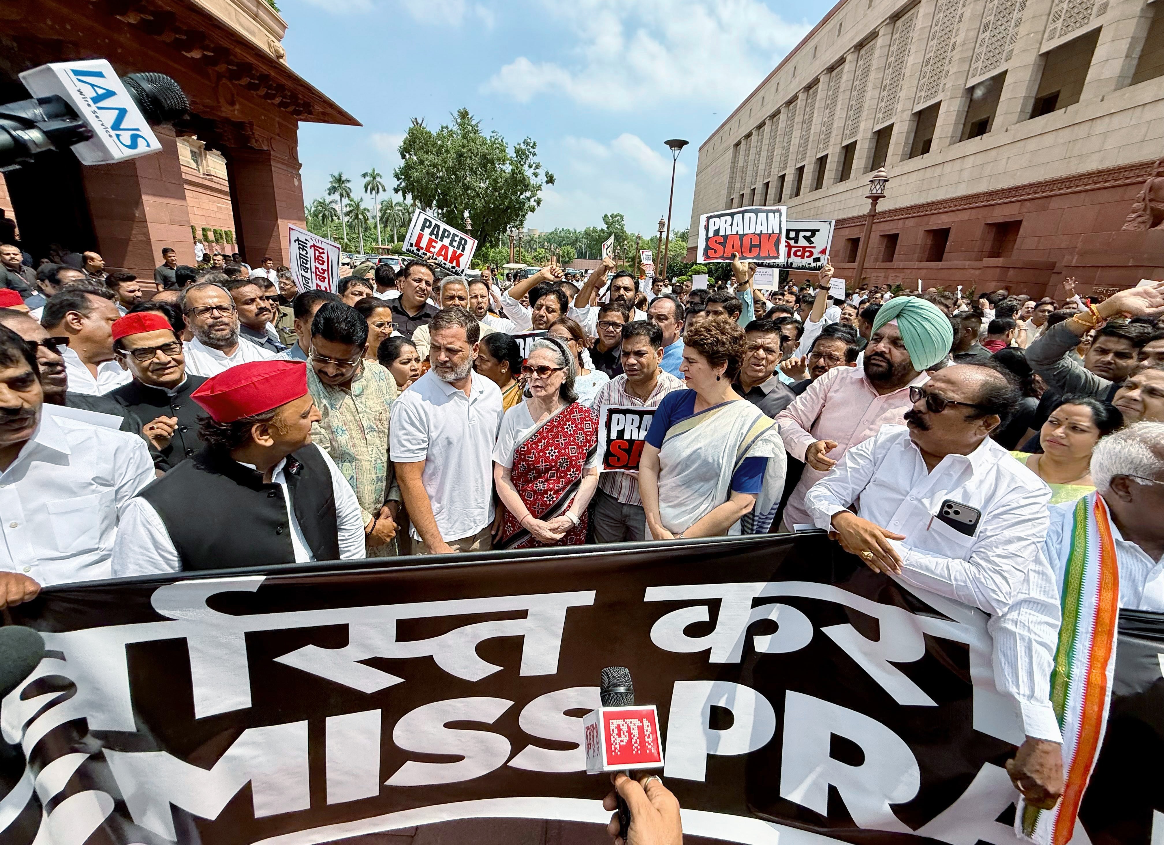 Congress Parliamentary Party chairperson Sonia Gandhi, Congress MP Priyanka Gandhi, Lok Sabha LoP Rahul Gandhi and Samajwadi Party National President Akhilesh Yadav with other opposition MPs take part in protest demanding the resignation of Union Education Minister Dharmendra Pradhan at the Parliament premises during the ongoing Monsoon Session, in New Delhi on Thursday. (@INCIndia X) Congress Parliamentary Party chairperson Sonia Gandhi, Congress MP Priyanka Gandhi, Lok Sabha LoP Rahul Gandhi and Samajwadi Party National President Akhilesh Yadav with other opposition MPs take part in protest demanding the resignation of Union Education Minister Dharmendra Pradhan at the Parliament premises during the ongoing Monsoon Session, in New Delhi on Thursday. (@INCIndia X)