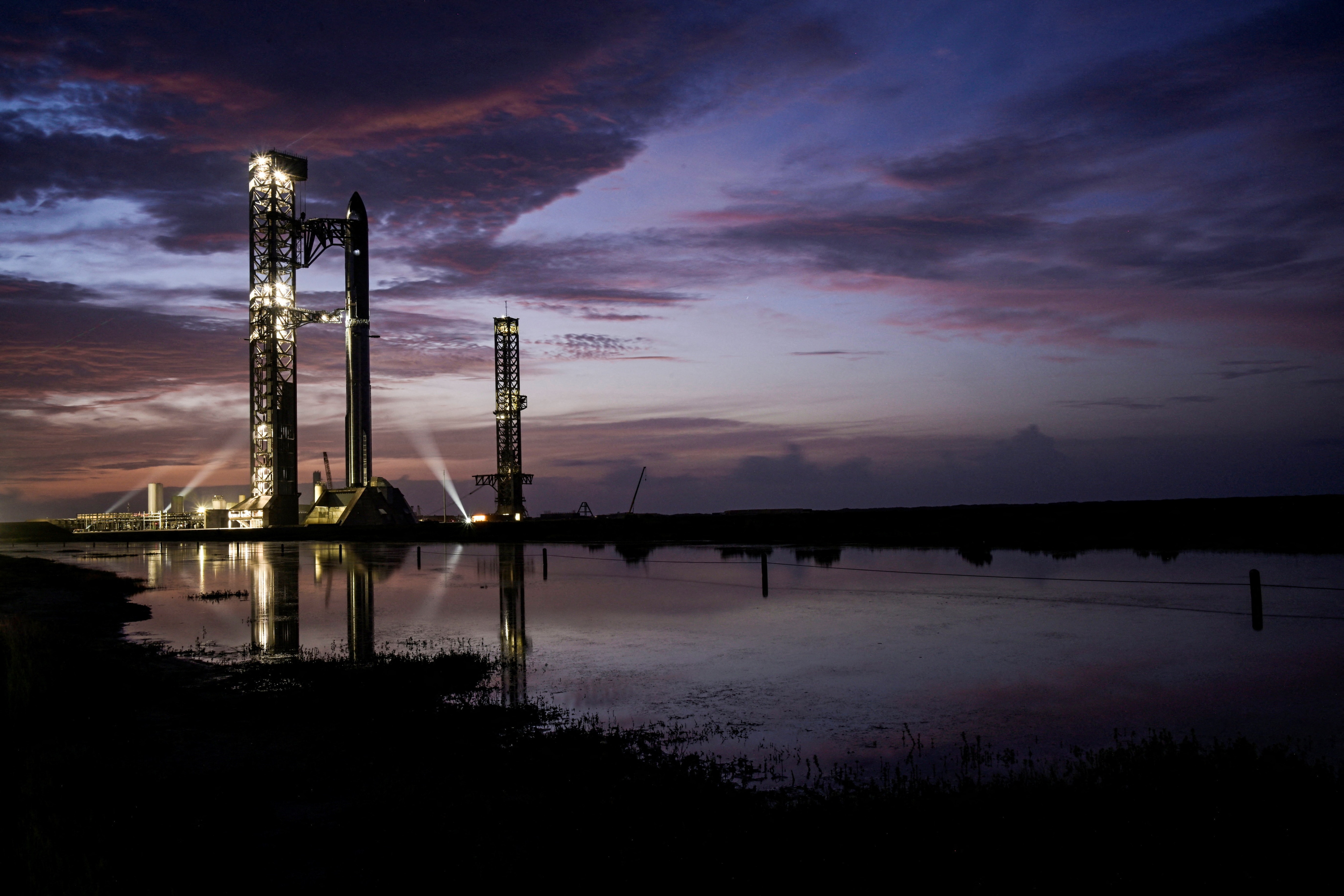The SpaceX Starship and Super Heavy v3 Booster stand at pad 2 at sunrise before its 13th test flight from the SpaceX launch complex in Starbase, Texas, (Reuters)