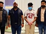 Gangster Jobanjit Singh, alias Joban Billa (wearing mask) with personnel of the Punjab Anti-Gangster Task Force (AGTF) while being brought back from Jakarta, Indonesia. (X)
