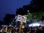 A man in Kolkata holds up a poster asking PM Modi to resign as he participates in a demonstration held in solidarity with Cockroach Janta Party (CJP) at Jantar Mantar in New Delhi.