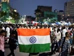 A man holds an Indian national flag as he participates in a demonstration in solidarity with Cockroach Janta Party (CJP) protests held at Jantar Mantar in New Delhi(REUTERS)