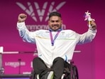 India's Jhandu Kumar celebrates after winning the bronze medal during the medal ceremony for the men's heavyweight para powerlifting event at the Commonwealth Games 2026, in Glasgow, Friday (PTI)