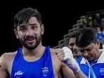 India's Sachin Siwach celebrates after winning the men's 60kg Round of 32 boxing match against Canada's Keoma Al-Ahmadieh during the 23rd Commonwealth Games, in Glasgow. (PTI)