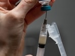 Measles causes fever, skin rashes, and respiratory symptoms.