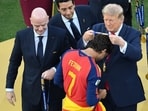 Donald Trump reacts to Ferran Torres' 'Make Spain Great Again' cap after Spain's World Cup triumph.