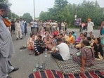Villagers protesting at the Hoshiarpur-Chandigarh bypass on Friday. (HT Photo)