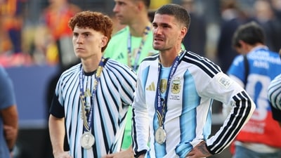 Argentina's Valentin Barco (L) and Argentina's Rodrigo De Paul (R) react during an awards ceremony after Spain won the World Cup final soccer match between Spain and Argentina. (AP Photo/Pamela Smith)