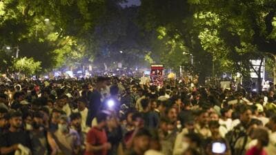 Demonstrators at the site during the protest by the Cockroach Janta Party (CJP) demanding the resignation of Union education minister Dharmendra Pradhan over the NEET paper leak issue, at Jantar Mantar in New Delhi on Friday. (PTI Photo)