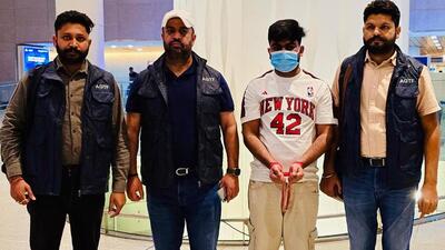 Gangster Jobanjit Singh, alias Joban Billa (wearing mask) with personnel of the Punjab Anti-Gangster Task Force (AGTF) while being brought back from Jakarta, Indonesia. (X)