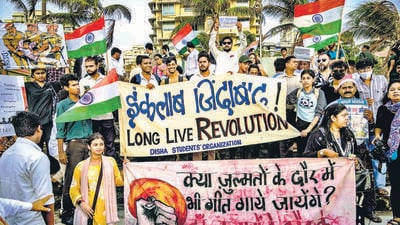 Mumbai, India - July 25, 2026: Thousands gathered at Bandstand in Bandra, Mumbai, for a massive student-led protest demanding the resignation of the Union Education Minister and action over competitive exam paper leaks, highlighted by a collective mass singing of the National Anthem (Rashtra Geet) while waving the Indian tricolour. in mumbai, India, on Saturday, July 25, 2026. (Photo by Satish Bate/ Hindustan Times) (Hindustan Times) Mumbai, India - July 25, 2026: Thousands gathered at Bandstand in Bandra, Mumbai, for a massive student-led protest demanding the resignation of the Union Education Minister and action over competitive exam paper leaks, highlighted by a collective mass singing of the National Anthem (Rashtra Geet) while waving the Indian tricolour. in mumbai, India, on Saturday, July 25, 2026. (Photo by Satish Bate/ Hindustan Times) (Hindustan Times)