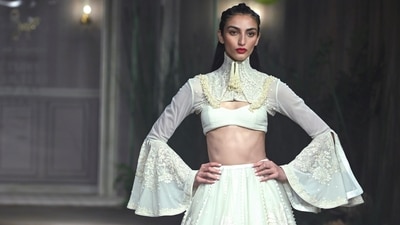 Lehengas paired with cropped velvet jackets and stunningly embroidered blouses were seen repeatedly throughout the show. (PTI) Lehengas paired with cropped velvet jackets and stunningly embroidered blouses were seen repeatedly throughout the show. (PTI)