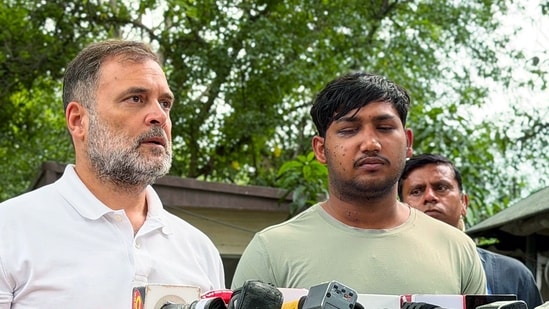 Lok Sabha LoP Rahul Gandhi speaks to the media along with a student, Sahil, injured in alleged police pellet firing during the protest on 20th July, in New Delhi on Friday.