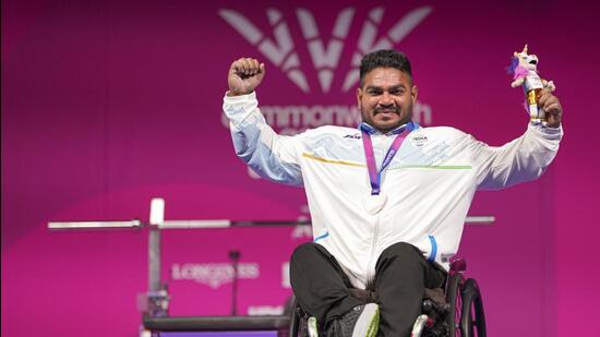 India's Jhandu Kumar celebrates after winning the bronze medal during the medal ceremony for the men's heavyweight para powerlifting event at the Commonwealth Games 2026, in Glasgow, Friday (PTI)