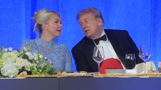 President Donald Trump talks with White House press secretary Karoline Leavitt at the White House Correspondents' Association dinner at the Waldorf Astoria Washington DC.