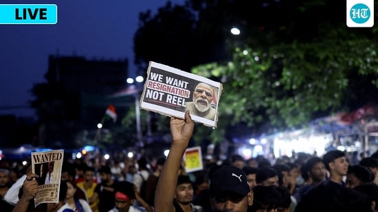 A man holds a poster as he participates in a demonstration held in solidarity with Cockroach Janta Party (CJP) protests held at Jantar Mantar in New Delhi.