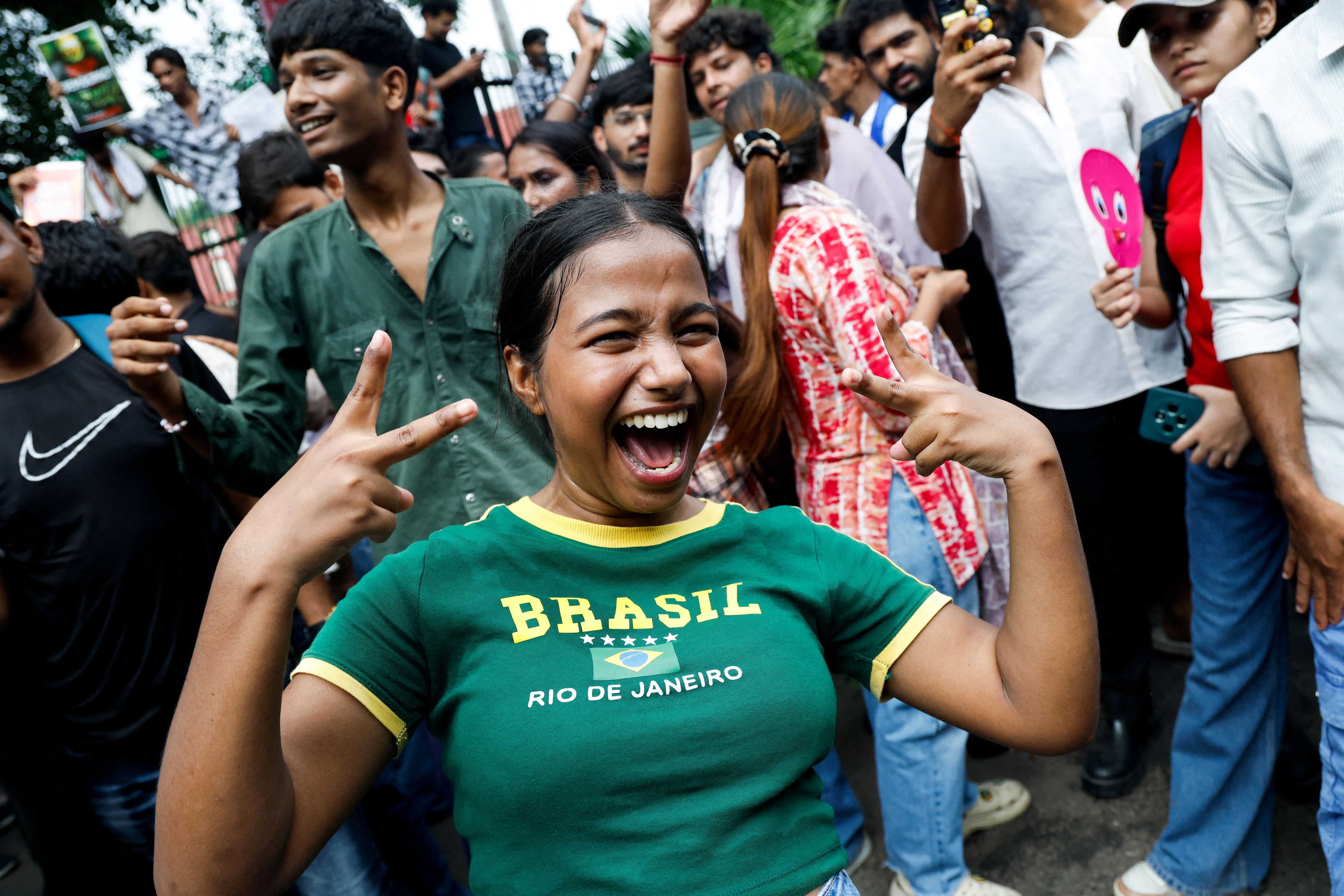 A supporter of the Cockroach Janta Party (CJP) celebrates after Education Minister Dharmendra Pradhan resigned following days of protests over paper leaks, in New Delhi on July 25, 2026. (Adnan Abidi/Reuters Photos)
