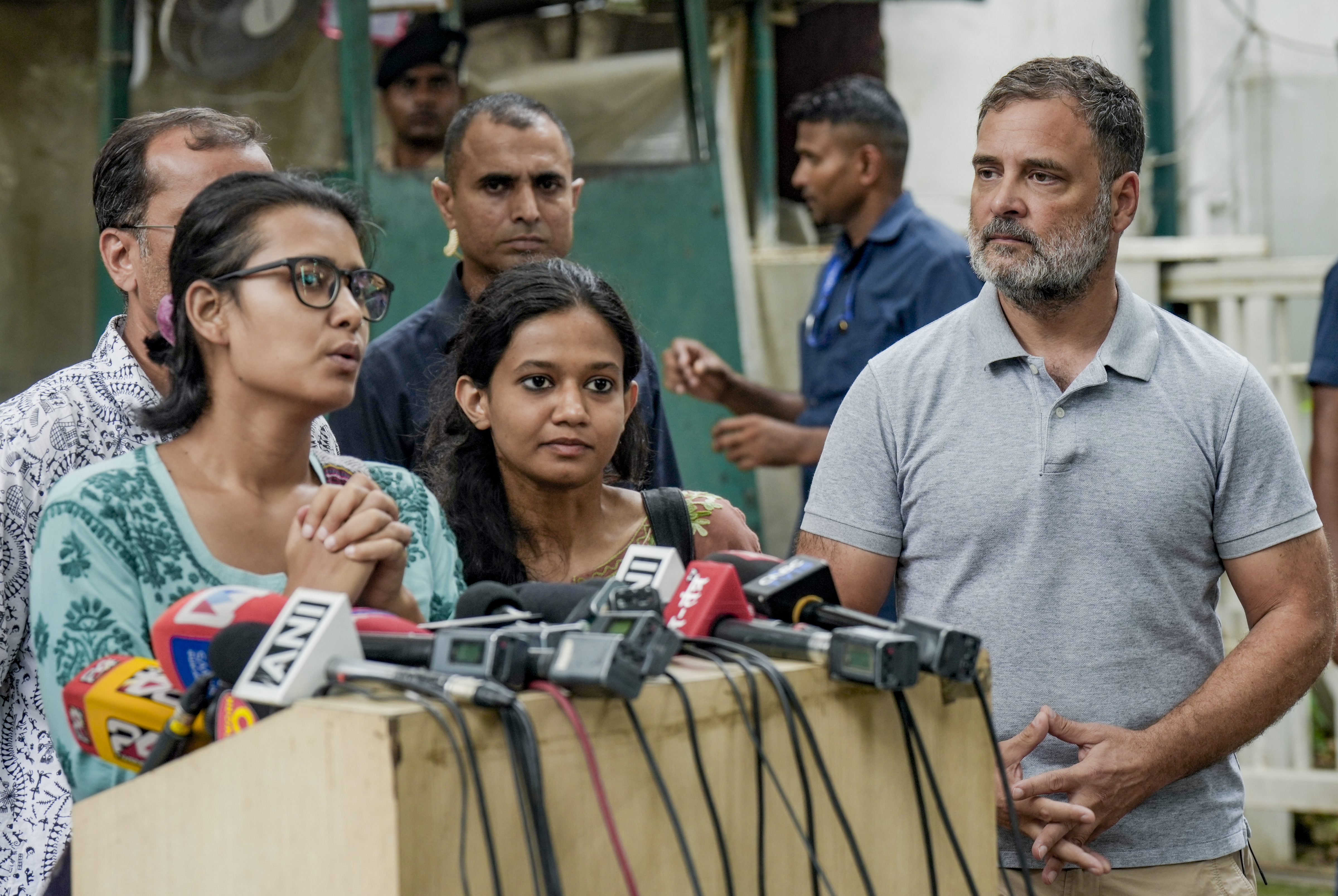 Congress MP Rahul Gandhi looks on as All India Students' Association (AISA) national president Neha Bora addresses a press conference. (PTI) Congress MP Rahul Gandhi looks on as All India Students' Association (AISA) national president Neha Bora addresses a press conference. (PTI)
