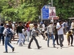 Protesters pelt stones during the 'Bihar Bandh' protest against the alleged NEET paper leak, in Patna on Saturday.