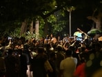 At around 10.15pm on Saturday, police estimated that a crowd of 4,000 people remained at the site. (Sanchit Khanna/HT Photo)