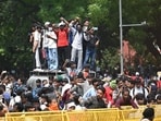 At around 10.15pm on Saturday, police estimated that a crowd of 4,000 people remained at the site. (Sanchit Khanna/HT Photo)