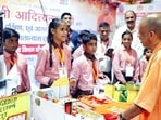Chief minister Yogi Adityanath interacting with students during a public event in Agra on Saturday. (ANI PHOTO)