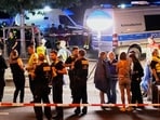 Emergency personnel and police gather in Berlin, early Sunday, July 26, 2026, following the cancellation of Christopher Street Day festivities.