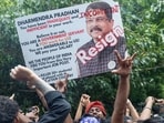 Supporters of India's Cockroach Janta Party (CJP) celebrate after India's Education Minister Dharmendra Pradhan resigned following days of protests in New Delhi, India, July 25, 2026.(REUTERS)