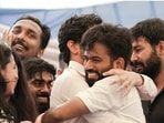 Cockroach Janta Party (CJP) Founder Abhijeet Dipke, with supporters, celebrates after Union Education Minister Dharmendra Pradhan resigned and took responsibility for the NEET paper leak, at Jantar Mantar in New Delhi.