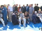 NASA astronaut Christopher Williams, Roscosmos cosmonauts Sergey Kud-Sverchkov and Sergei Mikaev rest after returning from the International Space Station (ISS) aboard the Soyuz MS-28 space capsule following their landing in a remote area near Zhezkazgan, Kazakhstan, July 26, 2026, 