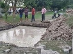 The victim, a resident of Kaladham Society in Knowledge Park 2, died after drowning in a 10-feet-deep water-filled pit on Saturday. (HT Photo)