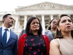 Rep. Pramila Jayapal (D., Wash.), in red, with members of the Congressional Progressive Caucus at the U.S. Capitol.